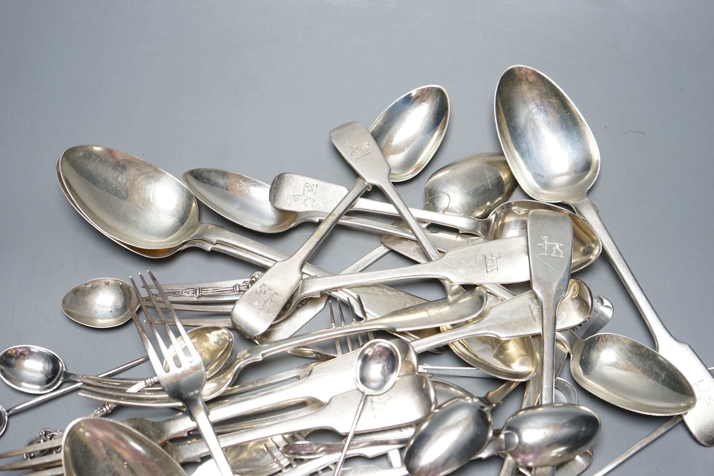 A set of six early Victorian Irish silver fiddle pattern table spoons, Philip Weekes, Dublin, 1844 and a quantity of assorted mainly 19th century flatware, various dates and makers